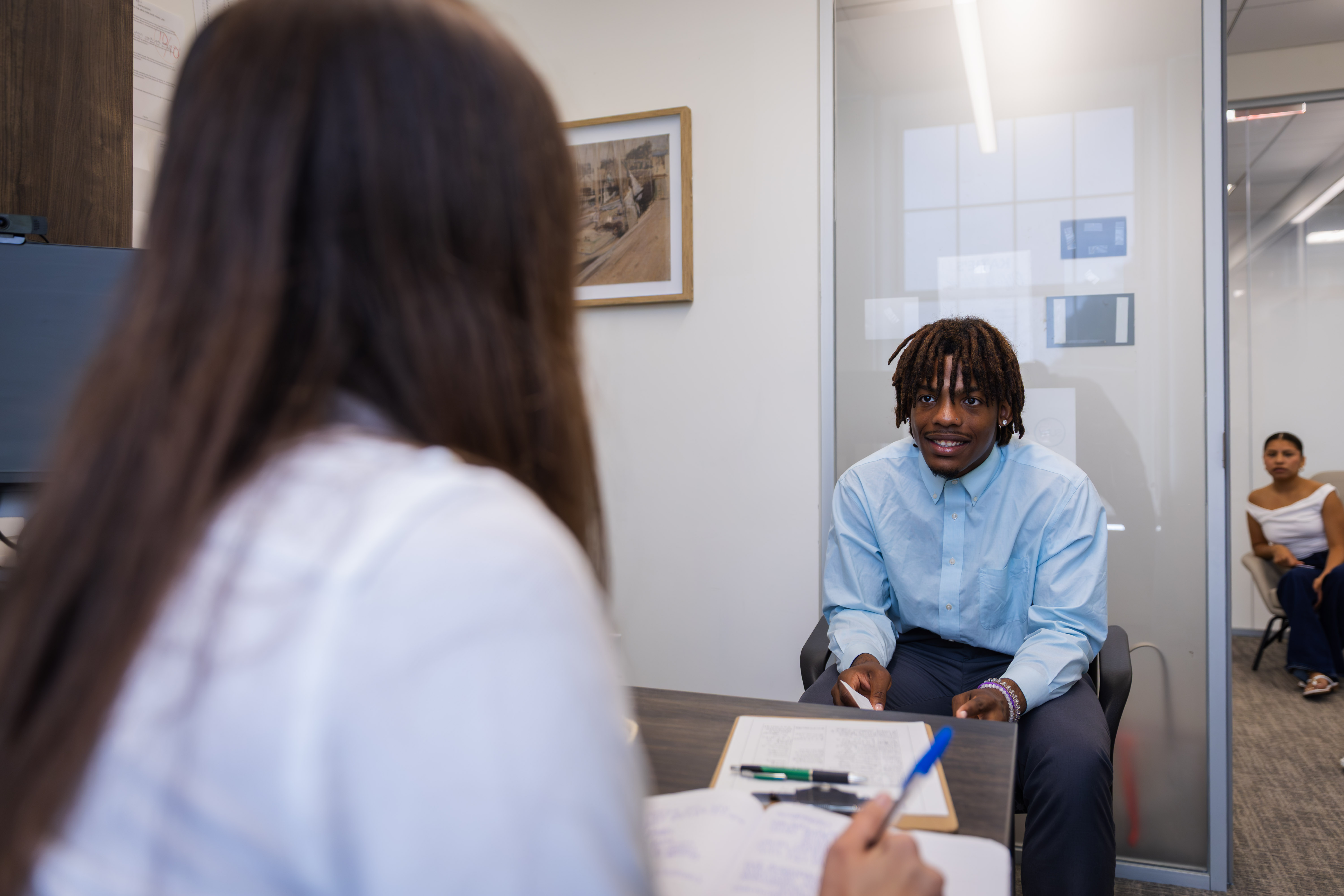 Student Success & Advising Center banner featuring an academic advisor meeting with a student in an office setting, with text reading: "Connect with your academic advisor and plan your next steps.